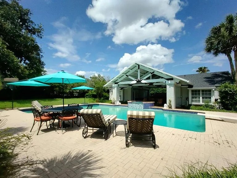 Backyard and poolhouse at 1218 SE 11th Street