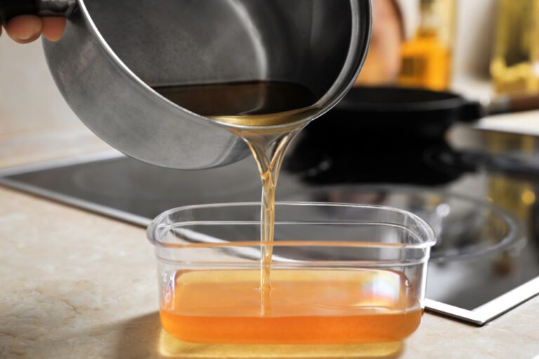 Cooking oil recycling stock image of oil being poured into container