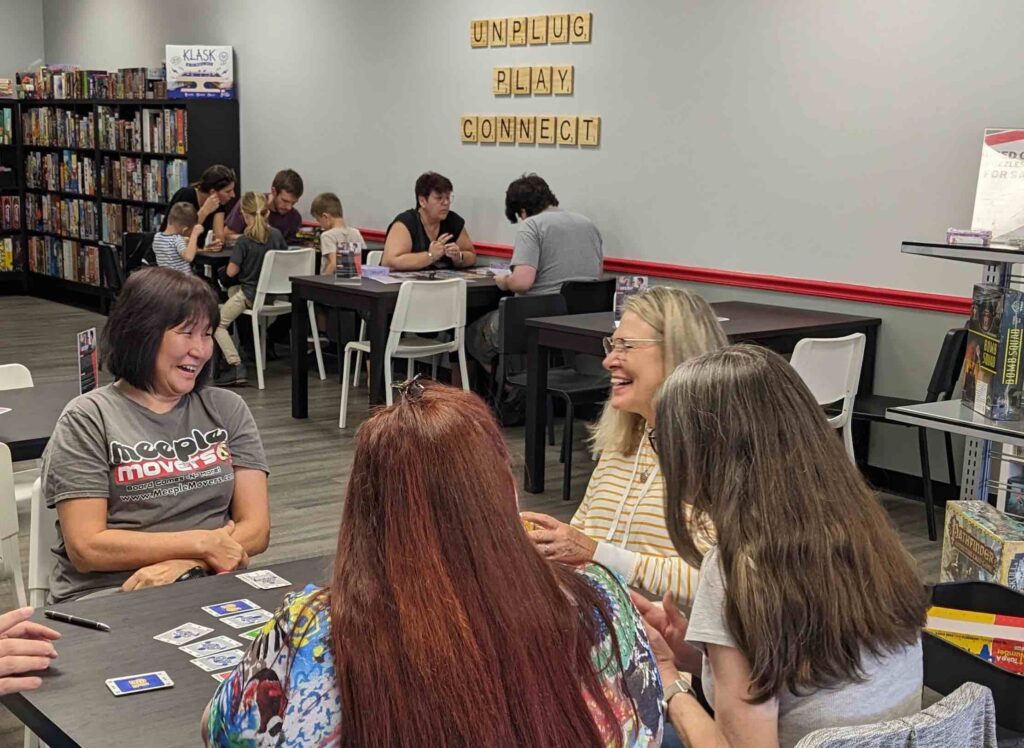 People playing games at Meeple Movers in Ocala